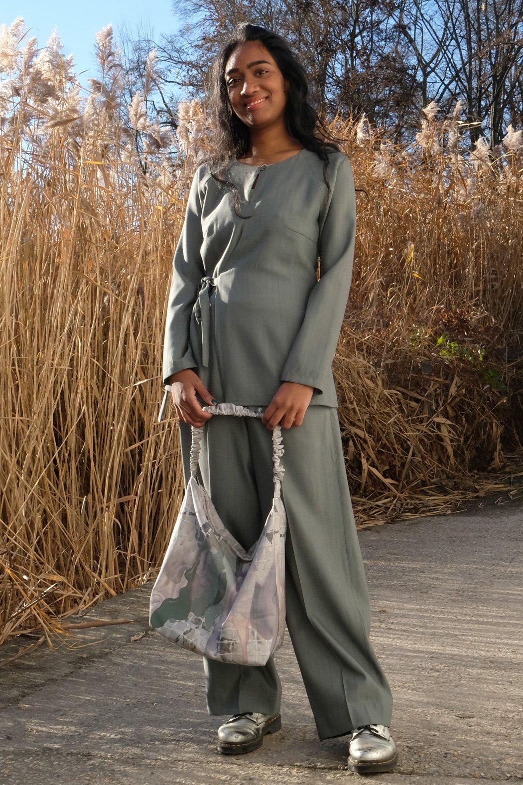 Green outfit with wrap blouse made in Berlin CLARA KAESDORF
