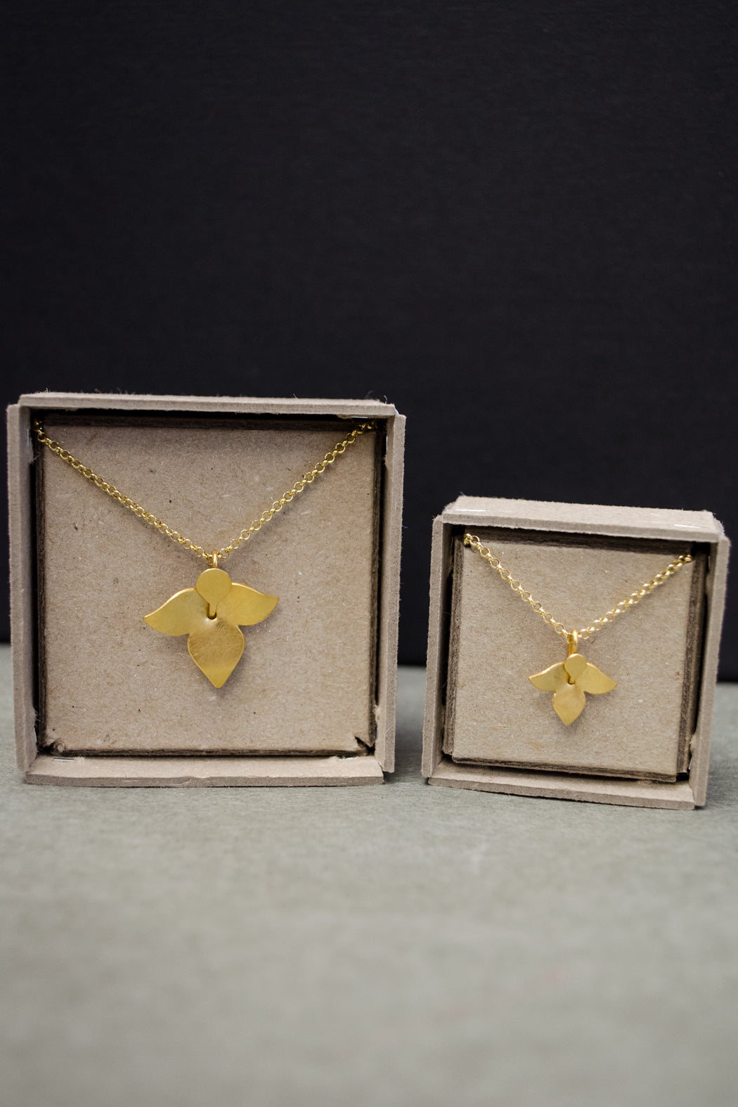 gold necklace with blossom pendant